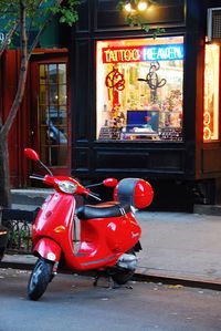 Red vintage car on street in city