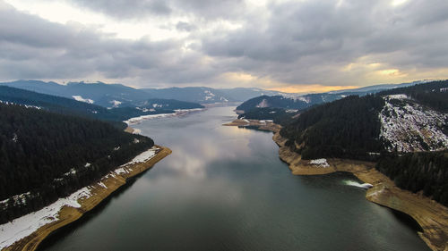 Panoramic view of river and mountains against sky