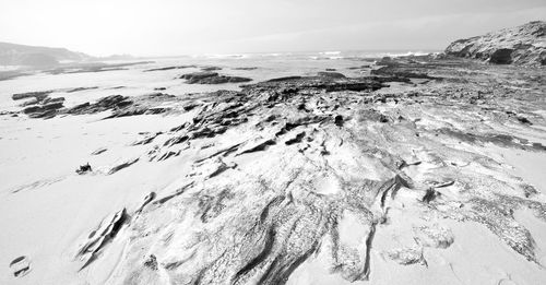 Aerial view of snow covered land