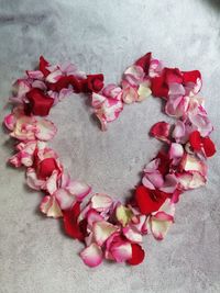 High angle view of heart shaped flowers on floor
