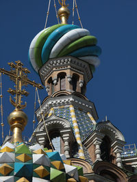 Low angle view of statue against blue sky