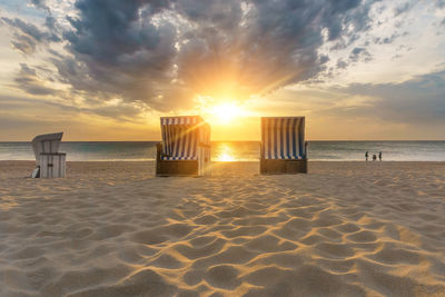 Scenic view of beach against sky during sunset