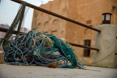 Close-up of fishing net against wall