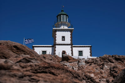 Akrotiri lighthouse, low angle view of building against clear blue sky