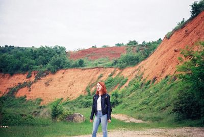 Woman standing on mountain