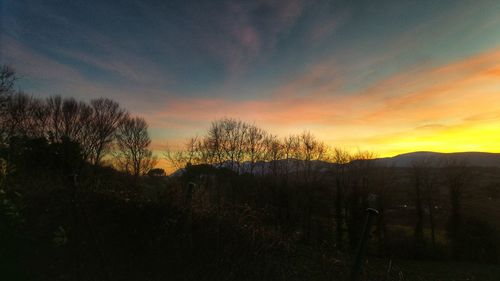 Scenic view of landscape at sunset