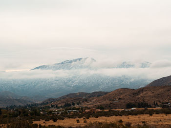 Scenic view of landscape and mountains against sky