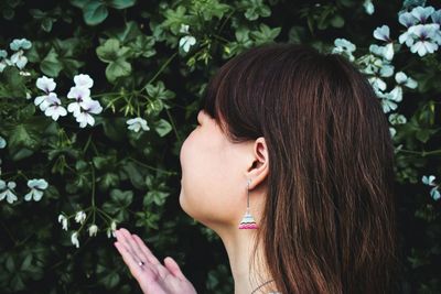 Portrait of woman with pink flowers