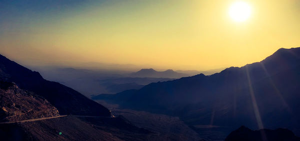 Scenic view of mountains against sky during sunset