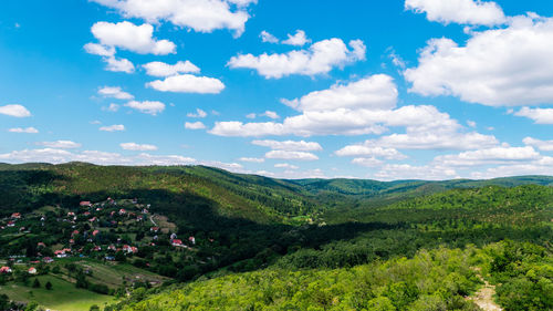 Scenic view of landscape and mountains against sky