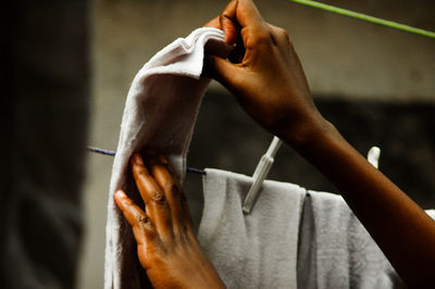 Cropped image of person hanging laundry