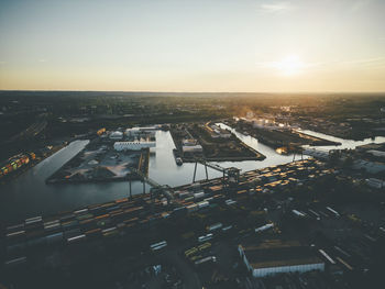 High angle view of city at sunset