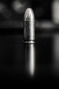 Close-up of bullet on table