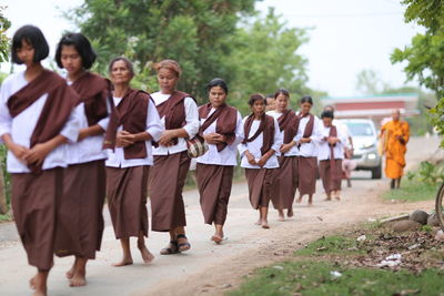 Group of people walking outdoors