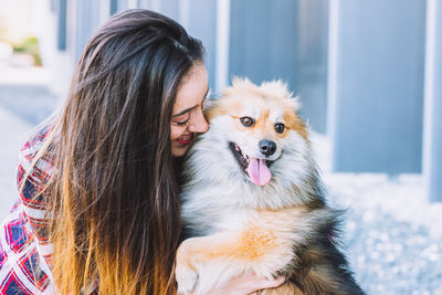 Portrait of woman with dog