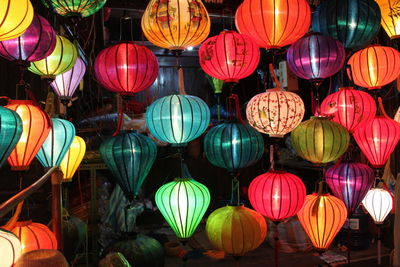Full frame shot of illuminated lanterns hanging in store