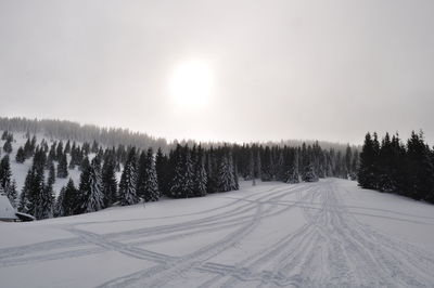 Scenic view of snow covered landscape against sky