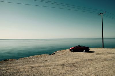 Boat on sea against clear sky