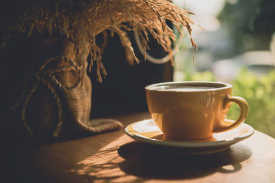 Close-up of coffee cup on table