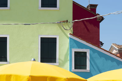 Low angle view of clothes drying on building