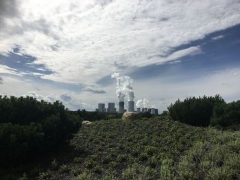 Panoramic view of factory against sky