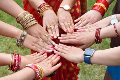 Cropped image of women hands wearing bangles