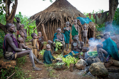 Group of people relaxing on land