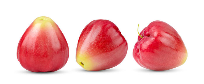 Close-up of apples against white background