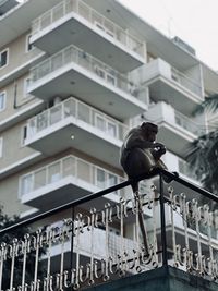 Low angle view of man walking on staircase