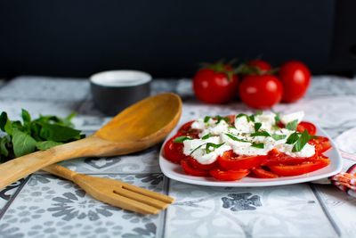 Close-up of fruits in plate on table
