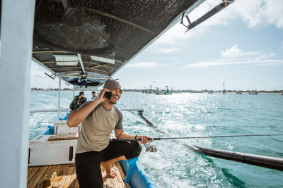 Portrait of man sitting on boat