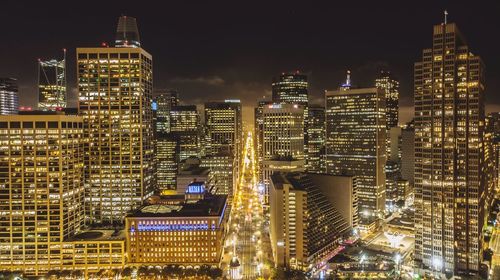 Illuminated buildings in city at night