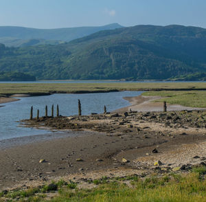 Scenic view of lake and mountains against sky