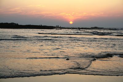 Scenic view of sea at sunset