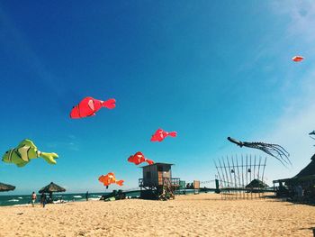 Scenic view of beach against blue sky