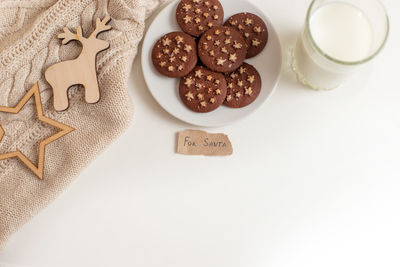 A round chocolate chip cookies lies on white plate