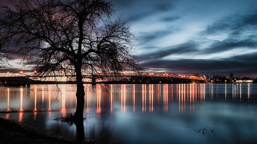 Scenic view of a river against sky at night