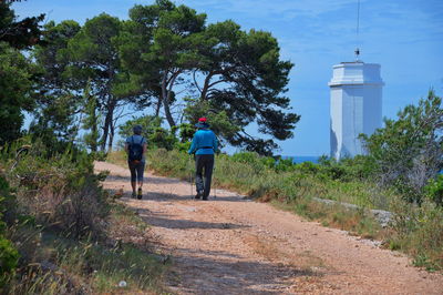 Two senior women walking along the sea shore