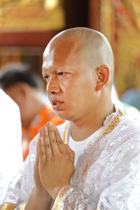 Monk praying during ordination