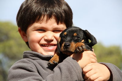 Portrait of boy with dog