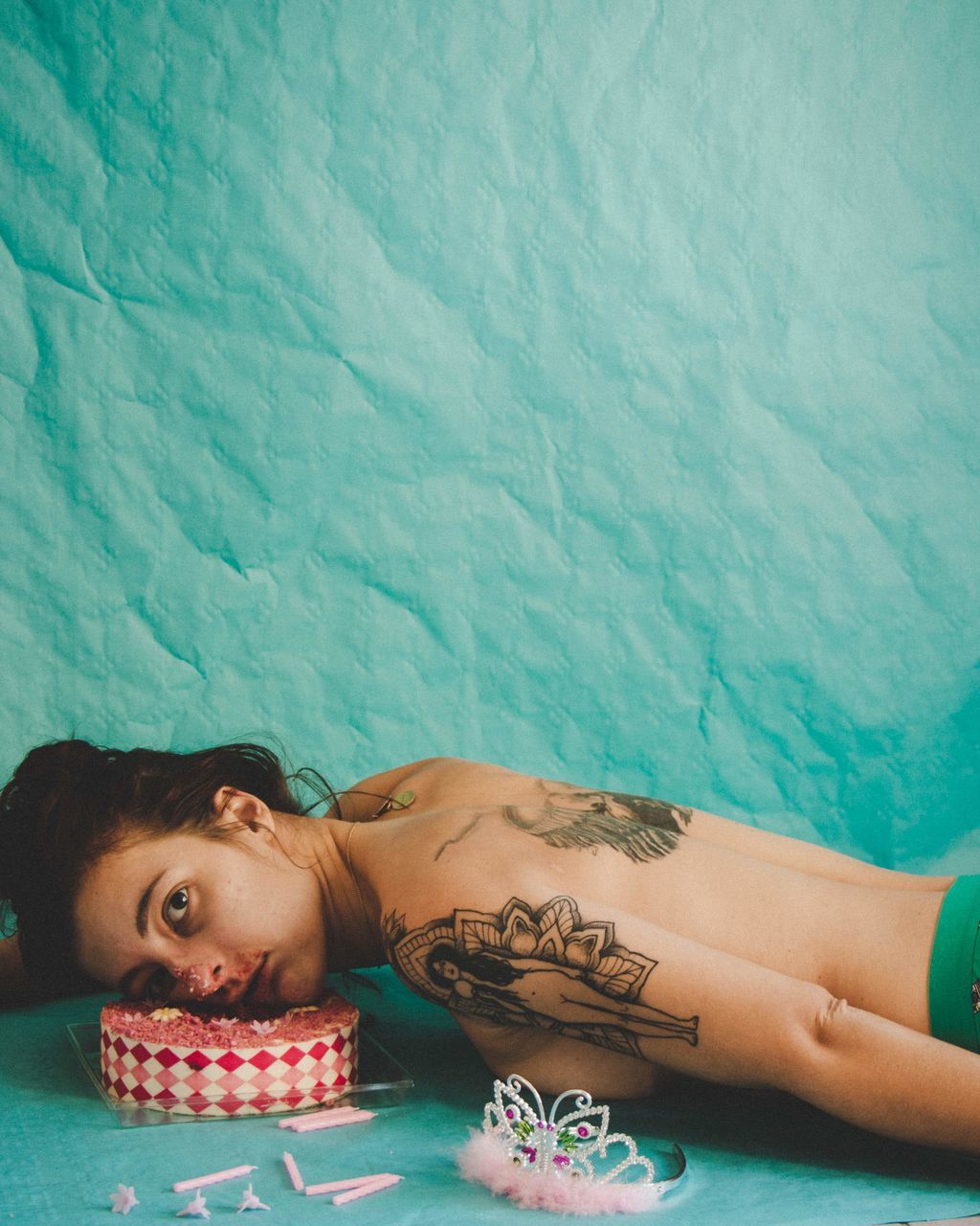 tattoo, young adult, one person, leisure activity, relaxation, women, portrait, headshot, lying down, lifestyles, real people, swimming pool, pool, adult, water, front view, nature, turquoise colored