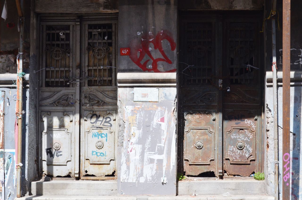 door, graffiti, day, architecture, no people, built structure, outdoors, vending machine