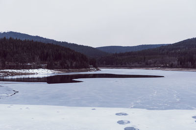 Scenic view of frozen landscape against clear sky
