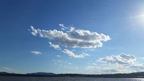 Scenic view of sea against blue sky