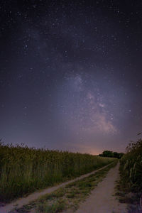 Scenic view of field against sky at night