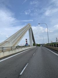 Bridge over highway against sky in city