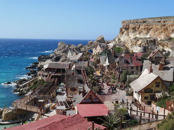 High angle view of townscape by sea