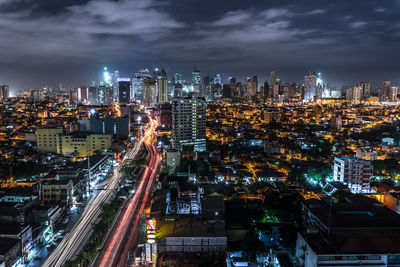 Aerial view of city lit up at night