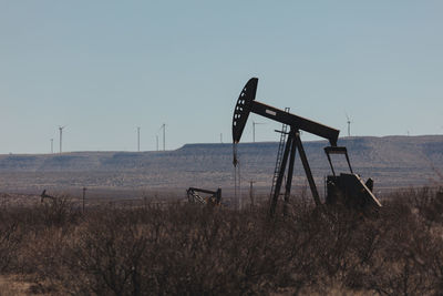 Lifeguard hut on field against clear sky