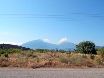 Scenic view of mountains against clear blue sky